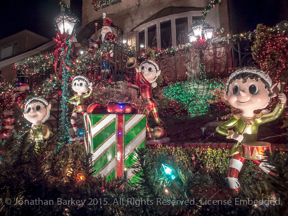 Dyker Heights Christmas Lights tour: a lawn with wrapped gifts and friendly figurines