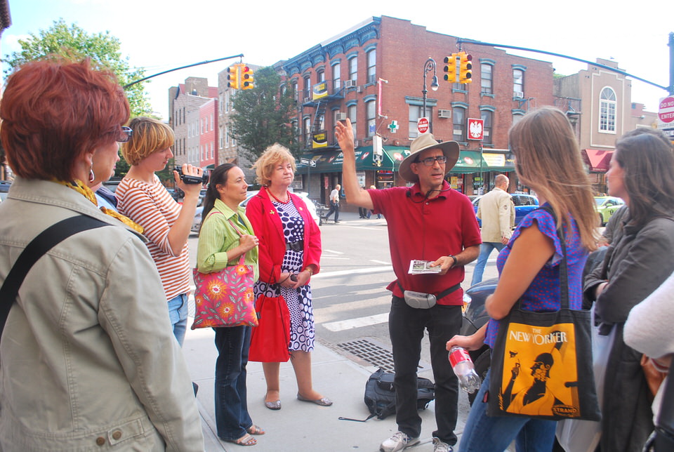 Brooklyn tour guide Norman Oder leads a group in Greenpoint
